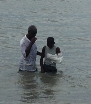 Lahai being baptized